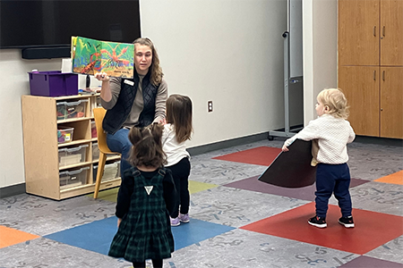 Toddler group participating in storytime at early reading skills daycare Bulverde