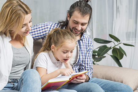 Family reading together at home 