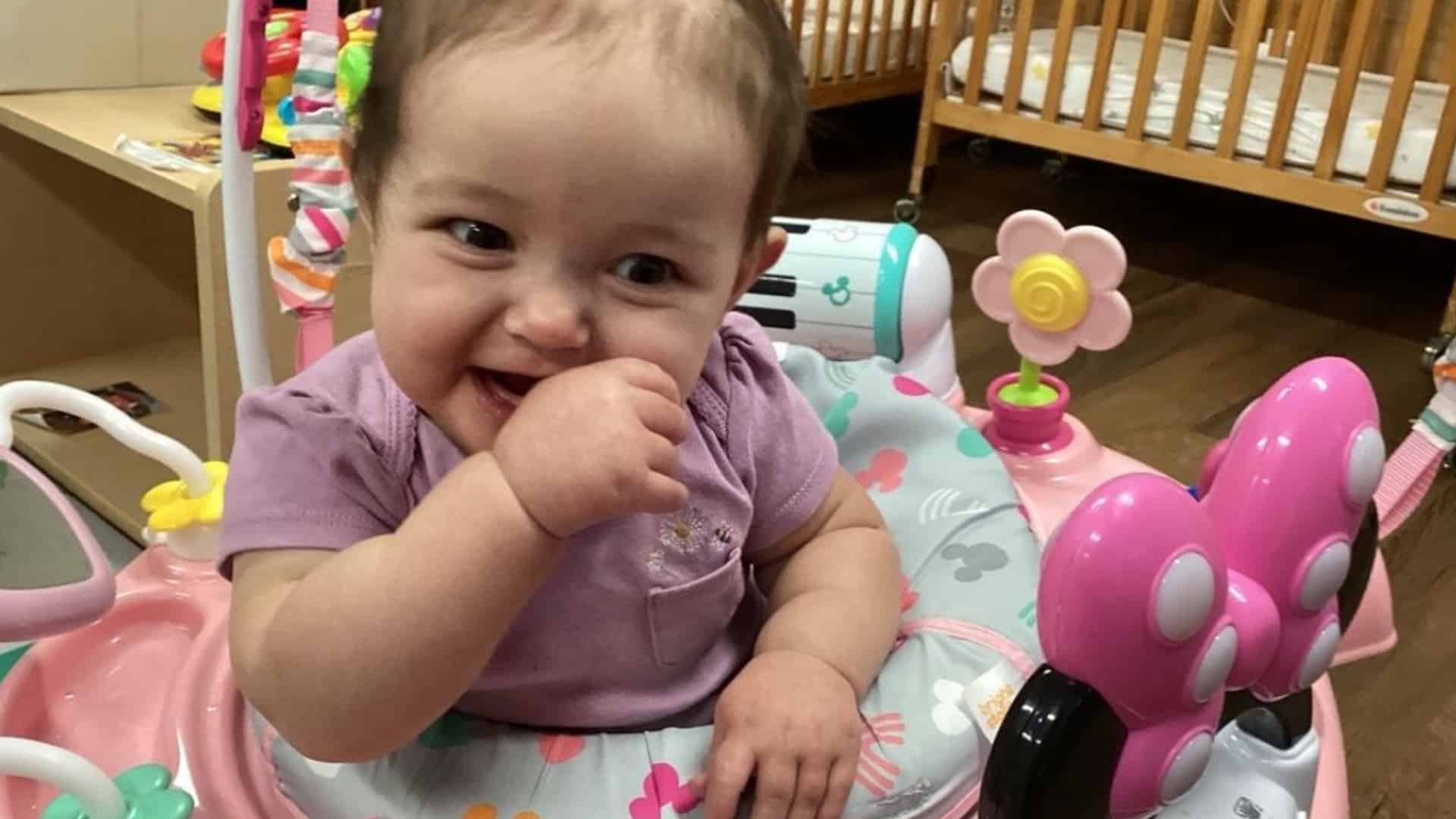 Happy child smiling and enjoying play activities in a daycare and early childhood education environment